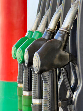 Colorful gas station nozzles detail