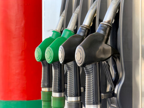 Colorful gas station nozzles detail