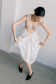 Contemporary couture fashion with sculptural white dress