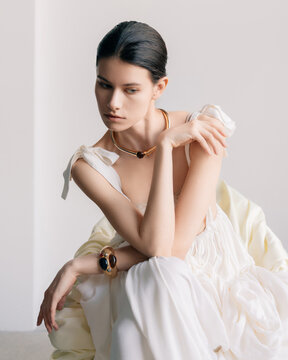 Elegant couture portrait with sculptural gold jewelry