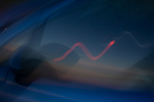 Abstract, colourful light patterns of moving cars shot at night 