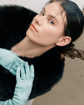 Cinematic beauty portrait with satin gloves and fur collar