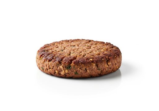 A single cooked plant based burger patty isolated on a clean white background isolated on white background