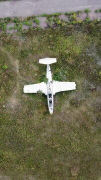 Drone look down view of retired Aero L-29 Delfin airplanes on neglected airfield