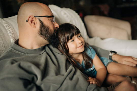 Happy father and young daughter sharing a warm moment together a
