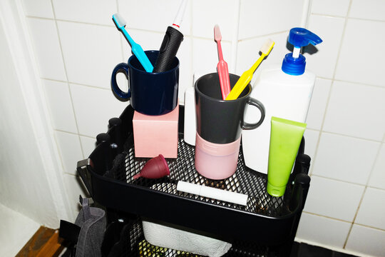Daily life hygiene items toothbrushes toothpaste on a shelf 