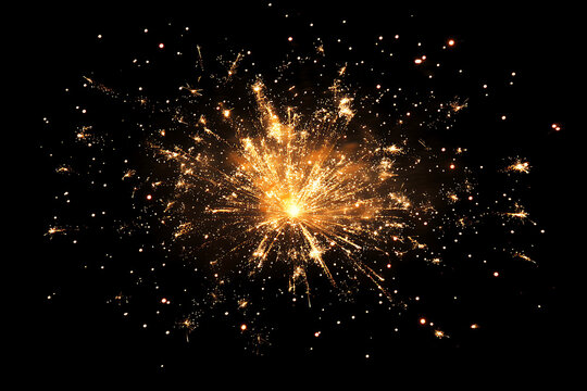 Bright golden firework explosion with shimmering sparkles and glowing particles burst isolated on a pure black background