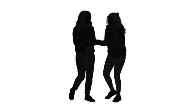 Two women embracing and hugging silhouette style