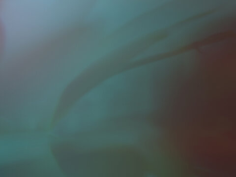 Dark moody abstract background with smooth sweeping shapes in deep teal and brown