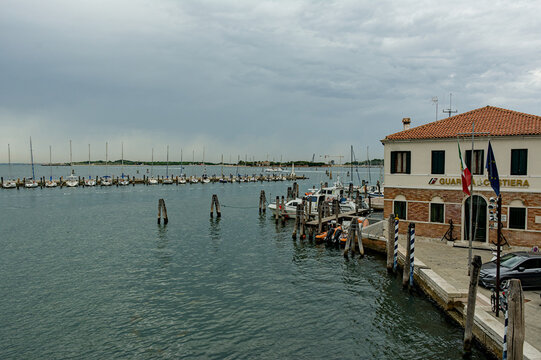 Marina with sailboats and flags in Chioggia, Italy