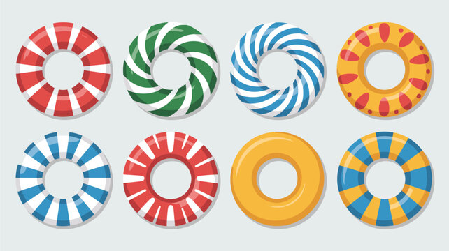 Collection of colorful inflatable swim rings with various patterns like stripes and dots for summer pool and beach activities in the sun.