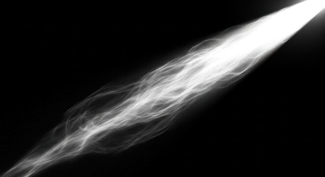 A beam of light shoots through smoke on a dark background.