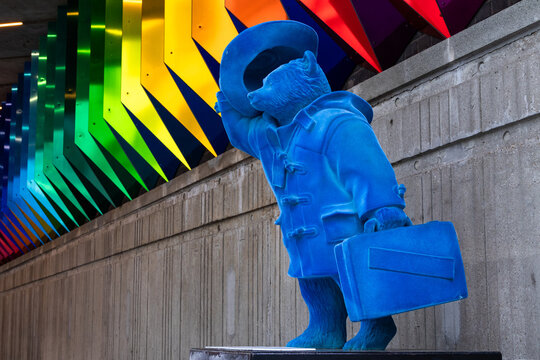 Paddington Bear statue "Bearing Up" close-up with a vibrant blue velvet surface together with the artwork "Colour Transfer" by Liz West in London, United Kingdom, June 1st, 2026
