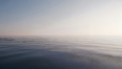 Fototapeta premium Serene ocean water with gentle ripples at sunrise or sunset with clear sky