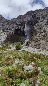 Aerial view of Deva Waterfall in Fuente D&eacute;, Cantabria. Stormy, windy and cloudy day in the high mountains.