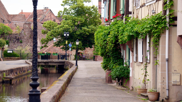 Quiet street in a small European town with traditional buildings, local architecture, and a calm everyday atmosphere. The scene reflects the character of a historic urban neighborhood in France or ano