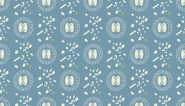 Seamless pattern of circular walnut halves, shell fragments, and small green dots on slate blue background.