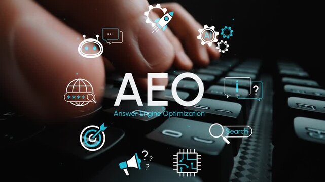 Hands Typing on Keyboard with AEO Text and Digital Icons Representing Answer Engine Optimization in a Modern Workspace Environment. Entropy.