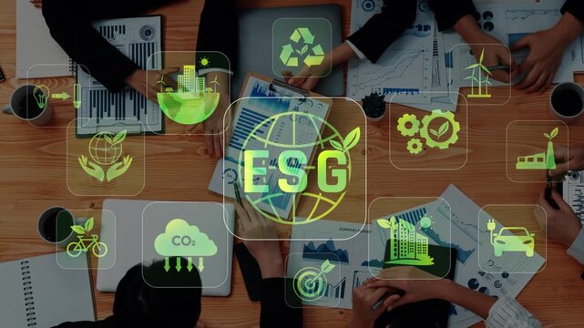 Diverse team meets to discuss ESG initiatives, showcasing charts and sustainable icons on wooden table, highlighting commitment to environmental and social governance. Raster