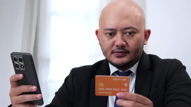 Close-Up of a Business Professional Making a Secure Online Purchase with a Smartphone and Credit Card, Showcasing Mobile Commerce, Digital Transactions, and Cashless Payment Solutions