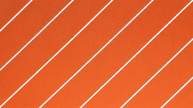 Top view of orange running track lanes with white diagonal lines