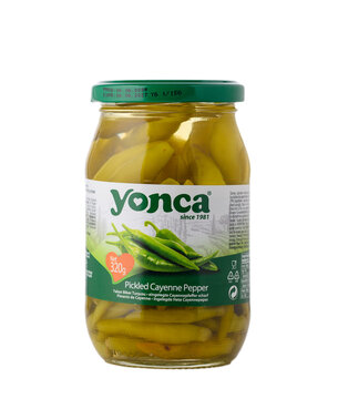 Gaziveren Cyprus -12.03.2025 Yonca Pickled cayenne pepper jar showcasing vibrant green color and enticing brand label against a simple background