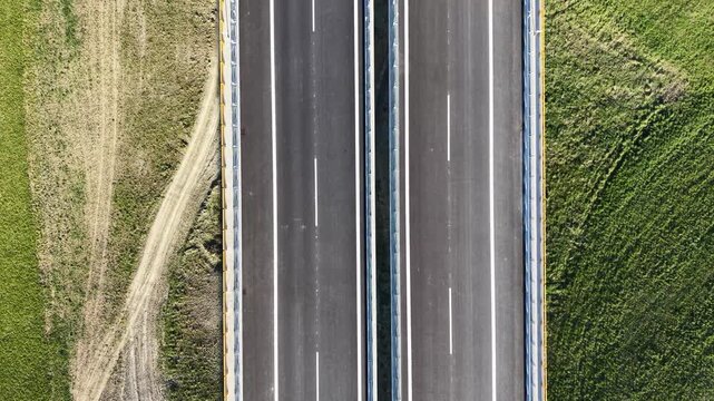Aerial footage of the newly constructed D1 motorway section between Ivachnov&aacute; and Hubov&aacute; near Ružomberok, showcasing modern transport infrastructure within the mountainous landscape of the Liptov regi