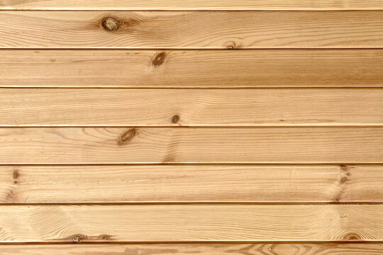 Natural light brown wood planks with knots background horizontal material carpentry backdrop flooring woodwork hardwood
