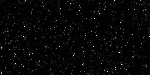 Obraz premium snow flakes falling down. Snowflakes gently falling against a dark night sky creating a serene winter atmosphere. Glowing stars in space. 