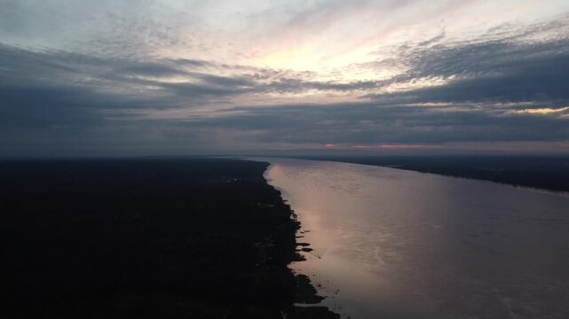 Santa clara de ojeal amazon river sunset aerial view from iquitos, peru