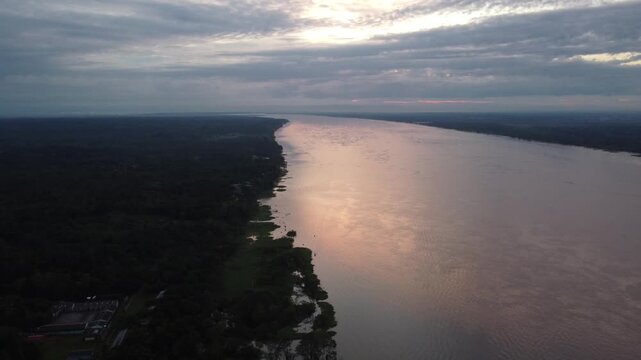 Santa clara de ojeal aerial view flying over the amazon river at sunset