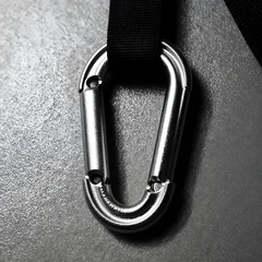Extreme macro photography of heavy-duty anti-theft guardian carabiner clips, highlighting the microscopic surface textures, design precision, and material properties... © stefanholm
