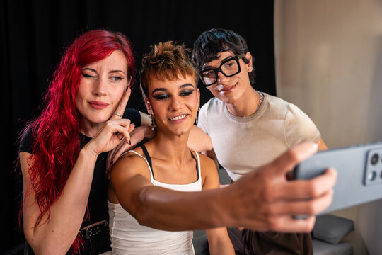 Fashion photoshoot crew taking a backstage selfie together
