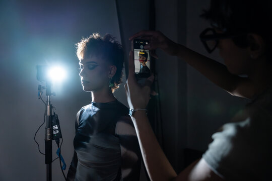 Backstage portrait with studio light and smartphone shoot