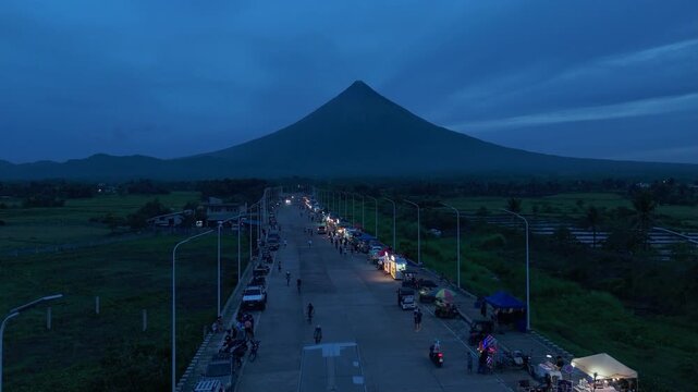 
Aerial view of San Vicente Bypass Road, Tabaco City, Philippines at twilight. Ideal for urban concepts.