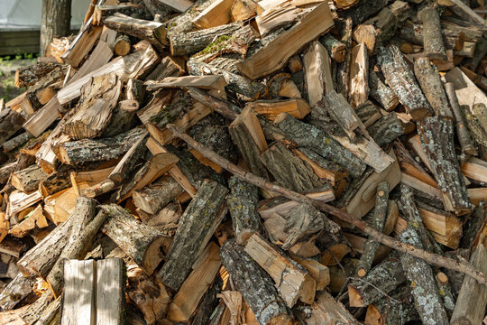 Stacked split firewood log pile