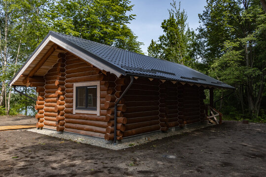 Wooden log cabin in forest