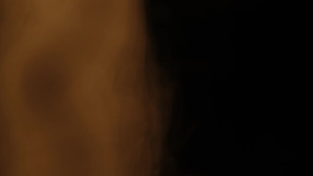rotating white smoke on a black background, creating elegant swirling patterns and atmospheric motion. Abstract smoke movement with soft textures, flowing shapes, and dramatic contrast