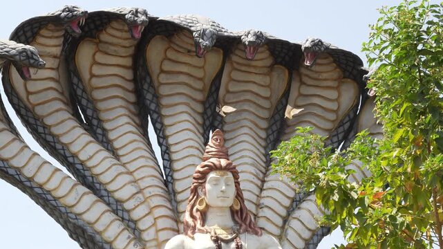 Lord Shiva Statue Beneath Multi Headed Serpent Canopy at Temple, mahakal corridor, Ujjain Shiva Shri Mahakaleshwar Jyotirlinga Temple