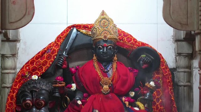 Kali Mata Idol Adorned with Traditional Red Attire and Ornaments