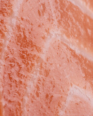 Fototapeta premium Raw salmon glossy texture vertical background fresh fish surface