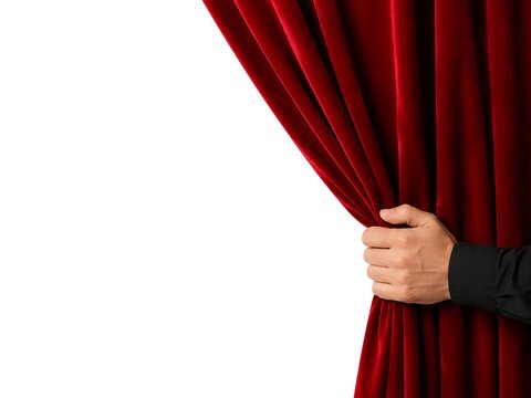 Man's hand pulling back red velvet curtain