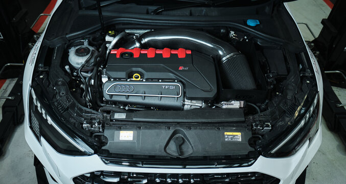 kent, uk, 01.01.2026 Audi RS TFSI turbocharged performance engine bay with carbon fibre intake system, high performance German sports car engineering and automotive technology