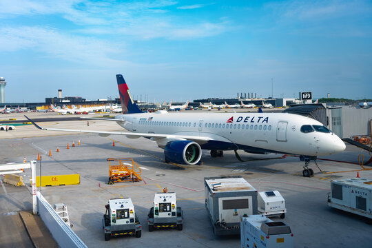 Chicago, Illinois, USA - June 15, 2025: Plane arrival of Delta airline. Departure and arrival at airport terminal. Airplane terminal. Travel by plane. Airport terminal. Aviation business