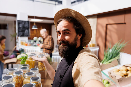 Zero waste shop owner does marketing inside a sustainable grocery store.