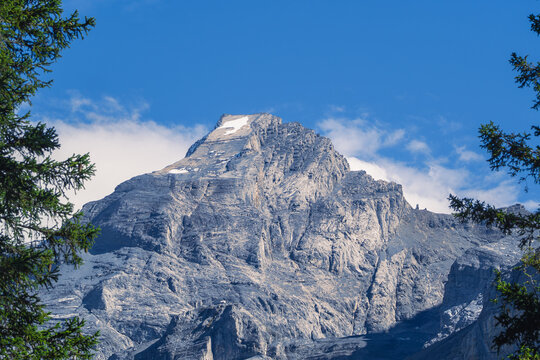 Dramatic limestone peaks rising above Oeschinen Lake in the Bernese Alps, Switzerland