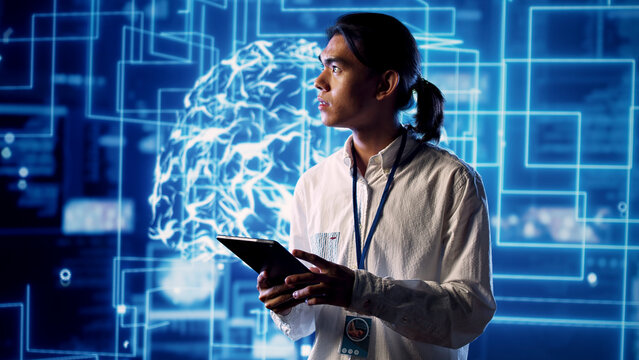 Developer working with artificial intelligence computerized model simulating human brain, worker looking at AI visualization showing machine learning algorithms using pattern recognition.