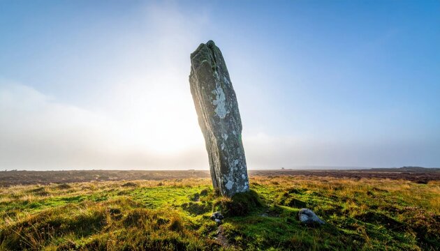 Ancient Standing Stone in a Misty Landscape at Sunrise.