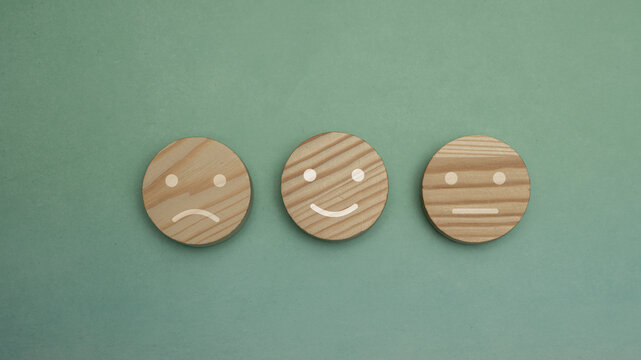 Wooden Mood Tokens Showing Sad, Happy And Neutral Faces For Feedback And Emotion Rating