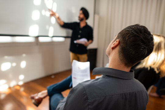 Business presentation with attentive audience.